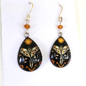 Moth and crescent moon teardrop earrings in golden yellow and black