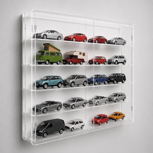 May include: A clear acrylic wall-mounted display case featuring five horizontal shelves. The case is filled with various miniature die-cast model cars, including sedans, SUVs, a green camper van, and a white van, arranged in organized rows.
