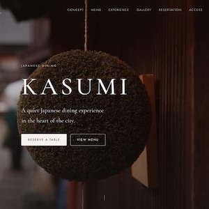 May include: A dark green, spherical cedar ball hangs by a string against a wooden surface. The text KASUMI JAPANESE DINING is visible, along with the phrases A quiet Japanese dining experience in the heart of the city, RESERVE A TABLE, and VIEW MENU.