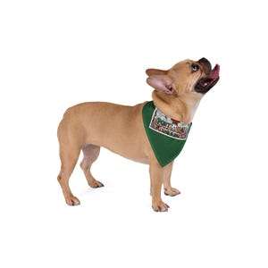 May include: A tan French Bulldog wearing a solid dark green triangular pet bandana. The bandana features a rectangular graphic patch with the text "PORTO" in green letters, a soccer ball, and red and white floral patterns on a white background.