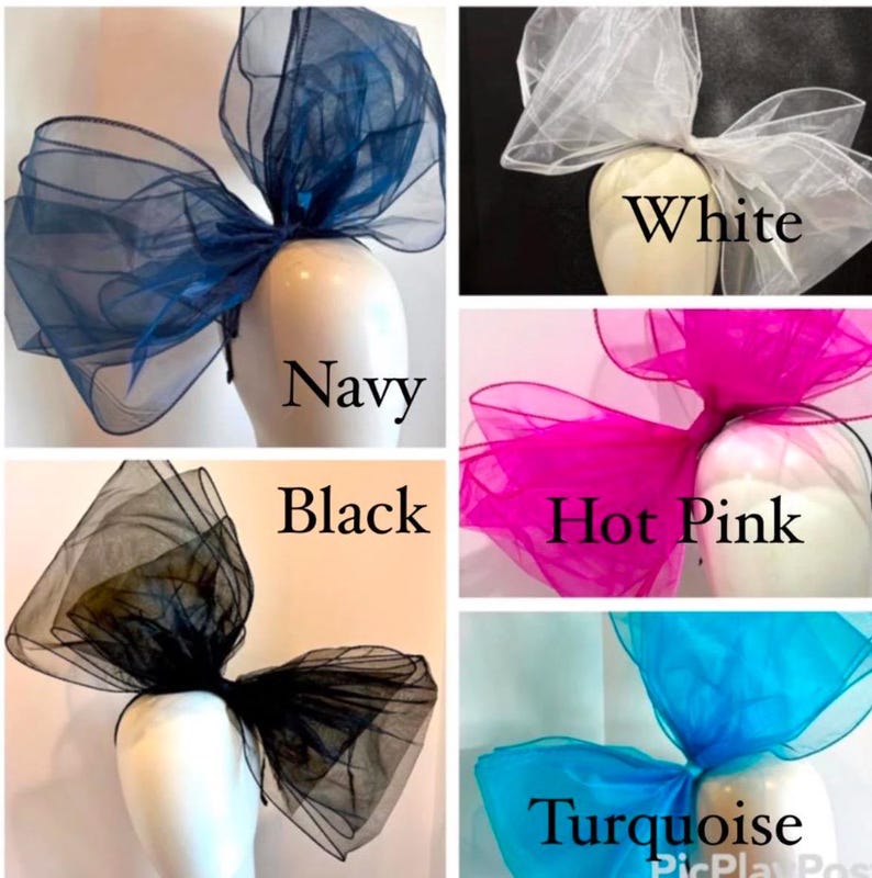 May include: Five large tulle bows in different colors: navy, white, hot pink, black, and turquoise. The bows are arranged in a grid pattern on a white background.