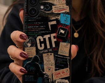 May include: A black smartphone case featuring a collage of cybersecurity themes, including a hooded figure, computer code, a globe, and text such as "CTF," "CAPTURE THE FLAG," "REALITY IS A VULNERABILITY," "TRUST NO INPUT," and "GAME ON. GOOD LUCK, HACKER."