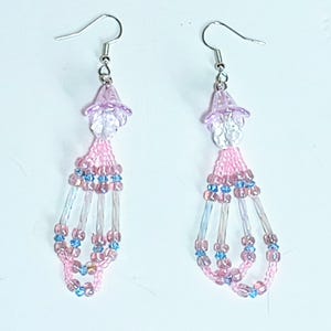 May include: A set of three ceramic mugs with a speckled, matte finish. The mugs are in shades of cream, light gray, and dark gray. Each mug has a simple, minimalist design, perfect for coffee or tea.