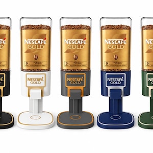 May include: Five Nescaf&eacute; Gold coffee dispensers in black, white, gray, blue, and green. Each unit features a clear cylindrical top filled with instant coffee granules, a gold label with the Nescaf&eacute; Gold logo, and a base with a dispensing lever.