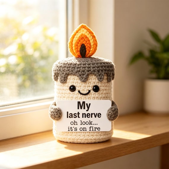 A tiny crocheted amigurumi doll that IS a candle — handmade yarn art meets functional object in a genuinely 'wait, what?' hybrid you won't find anywhere else.