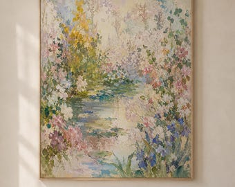 May include: A large rectangular framed oil painting featuring an impressionistic garden scene with a central pond surrounded by soft-toned flowers in shades of yellow, pink, blue, and green, displayed on a light-colored wall.