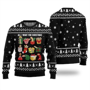 May include: A black long-sleeve crewneck jumper featuring a white snowflake and Christmas tree pattern. The front displays the text "ALL I WANT FOR CHRISTMAS" above a grid of twelve colourful gift boxes and stockings containing phallic shapes.