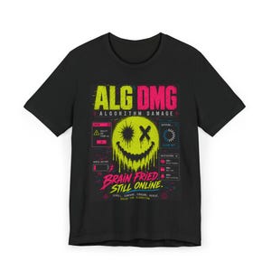 May include: A black t-shirt featuring a neon yellow melting smiley face graphic with an X eye. The design includes text reading ALG DMG ALGORITHM DAMAGE, BRAIN FRIED STILL ONLINE, and various digital interface elements in pink, blue, and yellow.