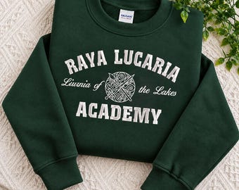 May include: A dark forest green long-sleeve crewneck sweatshirt featuring white embroidered text that reads RAYA LUCARIA ACADEMY and Liurnia of the Lakes, with a central circular emblem depicting two crossed swords over a swirling pattern.