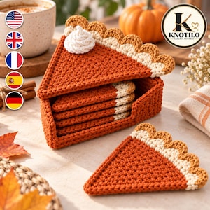 May include: A set of triangular crochet coasters shaped like pumpkin pie slices, featuring a deep orange body, a cream-coloured crust edge, and a white dollop of whipped cream on the top piece, all stored in a matching orange crochet holder.
