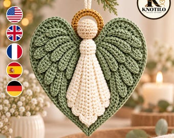 May include: A crocheted angel ornament featuring sage green wings and a cream-coloured body with a gold halo. The figure hangs from a cream string and includes a circular logo in the top right corner with the text KNOTILO CROCHET PATTERNS.