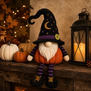 May include: A crocheted gnome doll with a pumpkin-shaped orange body, long white beard, and a tall black pointed hat featuring a gold crescent moon, purple stars, and a green button. The gnome has striped purple and black arms and legs.