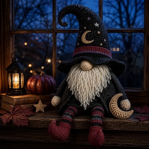 May include: A crocheted gnome doll wearing a tall black pointed hat decorated with a gold crescent moon and small stars. The gnome has a long cream-coloured yarn beard, striped legs in shades of red and black, and holds a gold crescent moon.