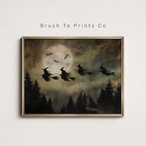 May include: A framed wall art print titled Brush To Prints Co featuring a dark, atmospheric scene of four silhouettes of witches flying on broomsticks against a large, pale full moon. Below, a dense, dark forest of pine trees is visible.