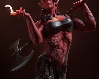 May include: A red-skinned humanoid figurine with horns, pointed ears, and dark hair. The figure wears a black crop top and black pants with straps, featuring dark tattoos on the arms and torso. One hand holds a small flame, while the other rests on a large double-bladed axe resting across the shoulders.