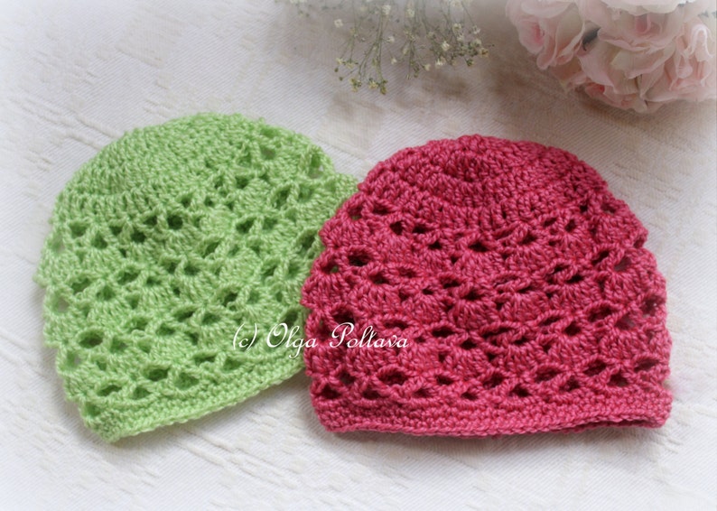May include: Two crocheted hats, one green and one pink, with a lacy pattern. The hats are made with a delicate stitch and have a soft, feminine look.