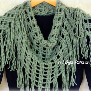 May include: A green crocheted shawl with fringe. The shawl is draped over a black shirt. The text (c) Olga Poltava is visible on the shawl.