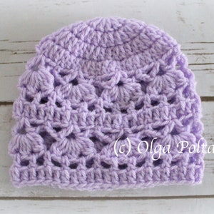 May include: A lavender crocheted hat with a delicate openwork pattern. (c) Olga Poltava