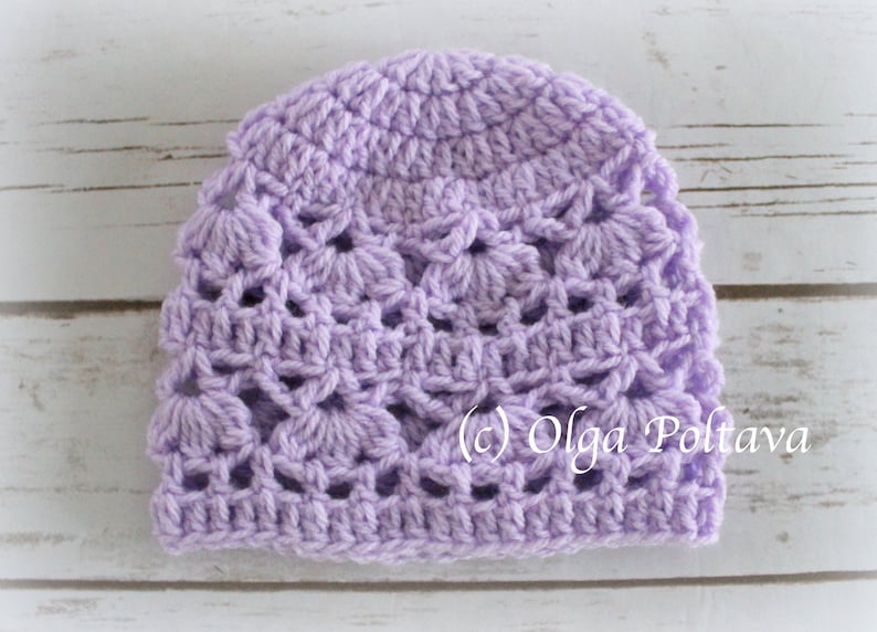 May include: A lavender crocheted hat with a delicate openwork pattern. (c) Olga Poltava