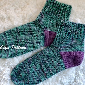 May include: A pair of green and purple ankle socks with a textured pattern. (c) Olga Poltava