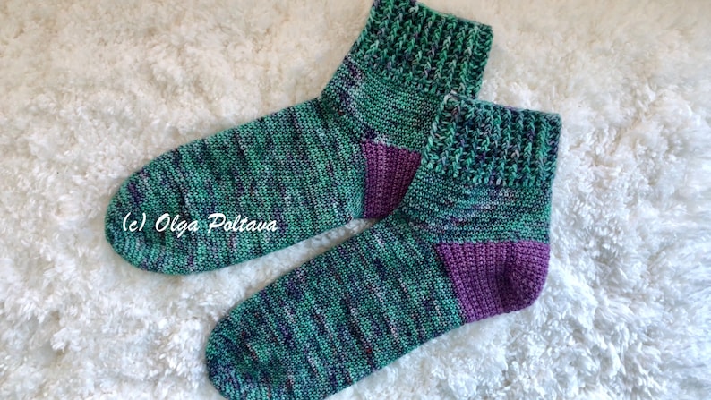 May include: A pair of green and purple ankle socks with a textured pattern. (c) Olga Poltava