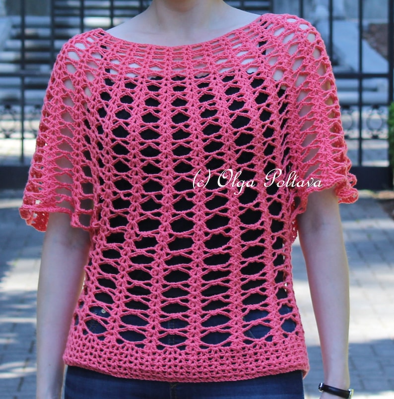 May include: Coral-colored crochet top with a loose, open weave design. The short-sleeved top has a boat neck and a scalloped edge on the sleeves. The text "(c) Olga Poltava" is visible on the right side of the top.