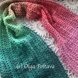 May include: A crocheted shawl with a gradient of colours, starting with a light peach colour, transitioning to a light green colour, and ending with a dark teal colour. The shawl is made with a delicate open stitch pattern. The text (c) Olga Poltava is visible in the lower left corner of the image.