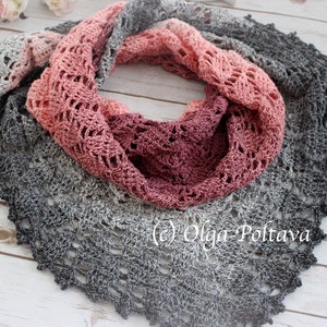 May include: A crocheted shawl with a gradient of grey, pink, and red colors. The shawl is made with a delicate lace pattern and has a scalloped edge.