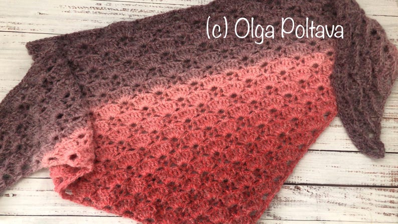 May include: A crocheted shawl with a gradient of colors from dark purple to pink. The shawl is made with a delicate open stitch pattern. The text (c) Olga Poltava is visible in the upper right corner of the image.