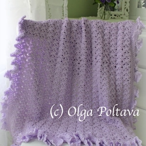 May include: A lavender crocheted baby blanket with a ruffled edge. The blanket is draped over a white chair. (c) Olga Poltava