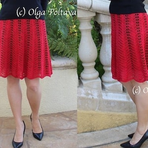 May include: A red crochet skirt with a scalloped hem. The skirt is made with a delicate stitch pattern and has a flowing silhouette.