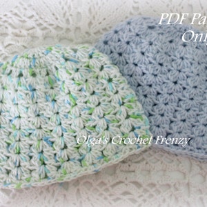 May include: Two crocheted hats, one in a light blue color and the other in a white color with blue and green accents. The text "PDF Pattern Only" is visible in the image.