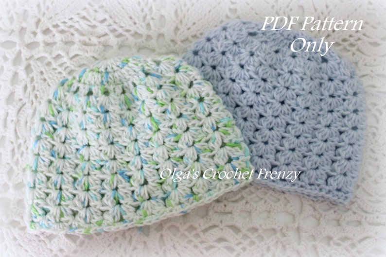 May include: Two crocheted hats, one in a light blue color and the other in a white color with blue and green accents. The text "PDF Pattern Only" is visible in the image.