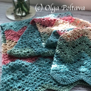 May include: A multi-colored crocheted blanket with a light blue, green, pink, and beige color scheme. The blanket is folded in a way that shows the different colors. The text (c) Olga Poltava is visible in the image.