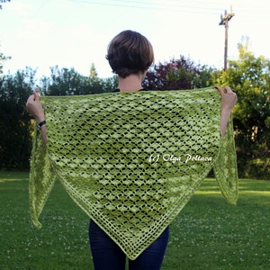 May include: A triangular crochet shawl in a vibrant lime green hue featuring an intricate openwork diamond pattern throughout the fabric. The shawl displays a textured stitch design with a decorative border and includes the text (c) Olga Poltava.