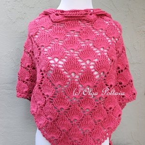 May include: A pink crocheted shawl with a scalloped design. The shawl is displayed on a white mannequin. The text "(c) Olga Poltava" is visible in the lower right corner of the image.