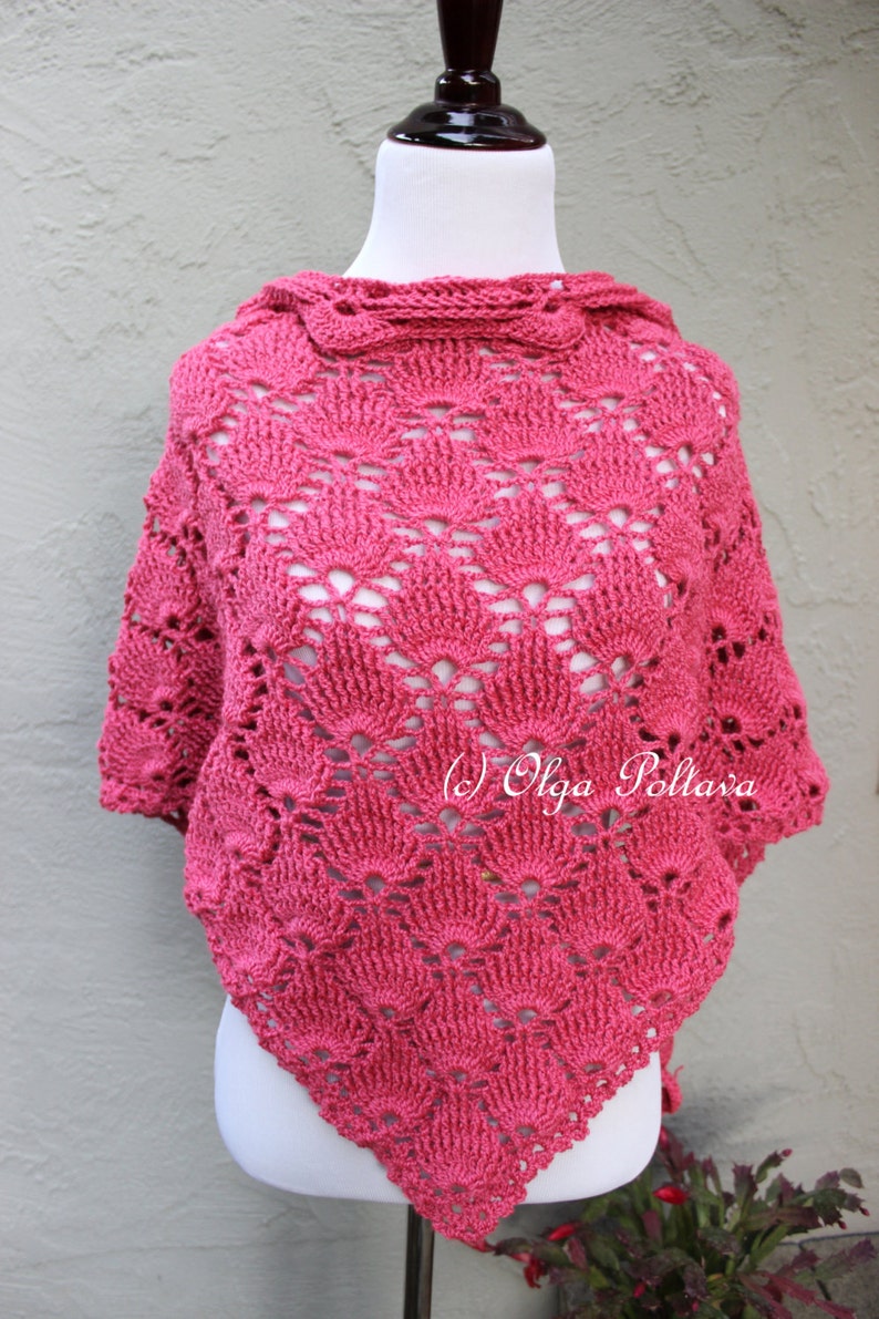 May include: A pink crocheted shawl with a scalloped design. The shawl is displayed on a white mannequin. The text "(c) Olga Poltava" is visible in the lower right corner of the image.
