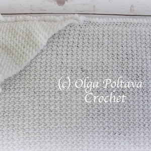 May include: A white crocheted blanket with a textured stitch pattern. The blanket is folded in half with a corner folded over. The text (c) Olga Poltava Crochet is visible in the image.