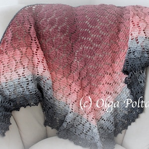 May include: A crocheted shawl with a gradient of pink, gray, and black. The shawl is draped over a white armchair. The text (c) Olga Poltava is visible in the lower right corner of the image.