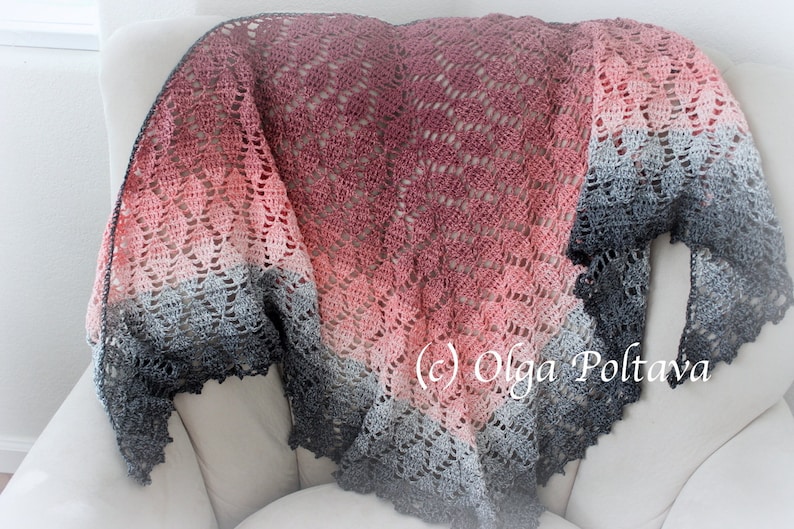 May include: A crocheted shawl with a gradient of pink, gray, and black. The shawl is draped over a white armchair. The text (c) Olga Poltava is visible in the lower right corner of the image.