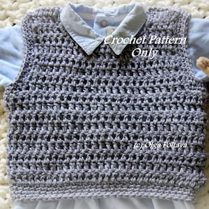 May include: A gray crochet vest with a crocheted pattern. The vest is laying on a white blanket. The text "Crochet Pattern Only" is written on the vest.