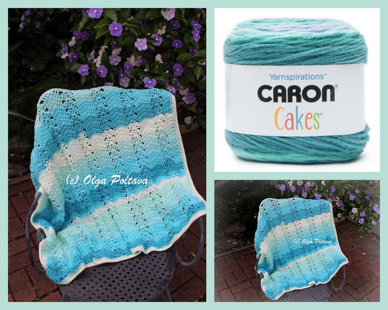 May include: A crocheted baby blanket in shades of blue and white, draped over a chair. The blanket features a wavy pattern and a scalloped edge. A ball of Caron Cakes yarn in matching colors is also shown.