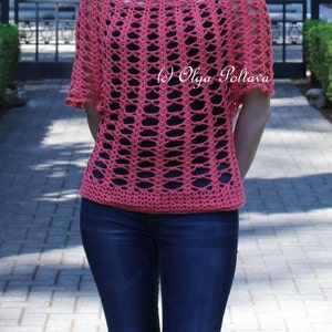 May include: A coral-colored, open-weave crochet top with short sleeves. The top has a wide neckline and a textured, lattice-like pattern. The text "(c) Olga Poltava" is visible on the top.