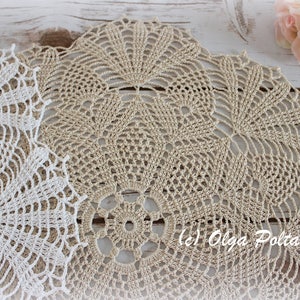 May include: Two crocheted doilies, one white and one beige, with intricate patterns. The beige doily has the text "(c) Olga Poltava" in the center.