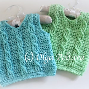 May include: Two crocheted sleeveless vests, one in a light blue green color and the other in a light green color. Both vests have a cable knit pattern and are hanging on hangers. The text (c) Olga Poltava is visible on the image.