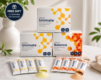 May include: Three rectangular boxes of Unicity Unimate and Balance dietary supplements, featuring yellow and orange molecular patterns. Four Unimate sachets with yellow powder and four Balance sachets with orange powder are arranged in front.
