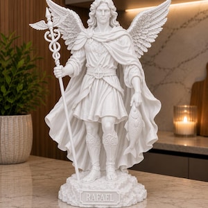 May include: A white statue of an angel with large wings, wearing a tunic and cape, holding a caduceus staff in one hand and a fish in the other. The figure stands on a base with the name RAFAEL inscribed on the front, featuring detailed textures.