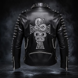 May include: A black leather jacket featuring silver metal spikes along the shoulders and sleeves. The back displays a large white embroidered cross with a coiled snake graphic. Silver chains are attached to the sides and lower back.