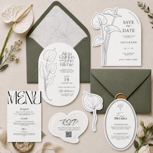 Può includere: Un set di cancelleria per matrimoni composto da cartoncini bianchi con disegni a linee nere di fiori di anthurium. Include un invito ovale, un save the date ad arco, un menu, una scheda RSVP con codice QR e due buste verde oliva.