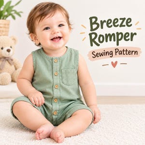 May include: A sage green sleeveless romper with a front button placket, a small chest pocket, and wooden buttons. The text Breeze Romper Sewing Pattern is displayed in dark green and brown script with a small heart icon next to the garment.